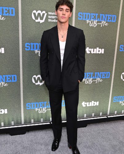 Noah Beck wears Tommy Hilfiger to Sidelined - The QB and Me Movie Premiere in Los Angeles (Photo By Getty Images_Michael Tullberg)