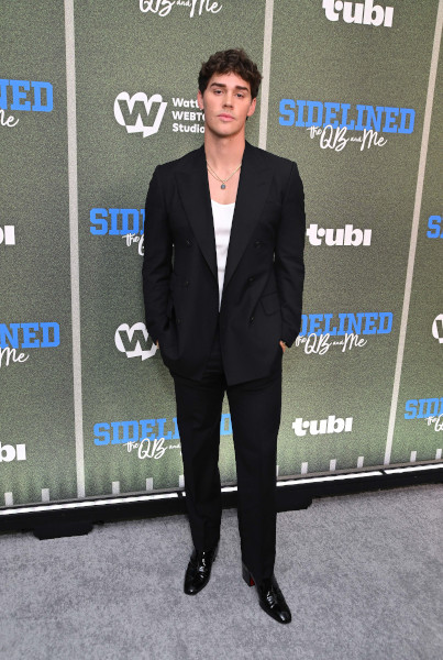 Noah Beck wears Tommy Hilfiger to Sidelined - The QB and Me Movie Premiere in Los Angeles (Photo By Getty Images_Michael Tullberg)